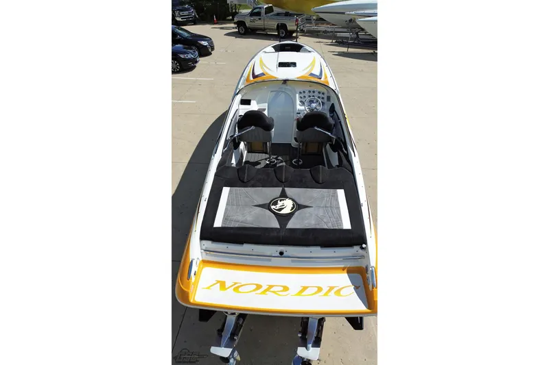 Slide: The Image of 2008 Nordic Powerboats 35 Flame MCOB, sleek design, parked outdoors. - 49