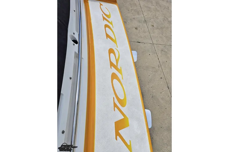 Slide: The Image of 2008 Nordic Powerboats 35 Flame MCOB, close-up of deck with logo. - 50