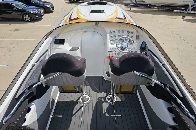 Slide: The Image of 2008 Nordic Powerboats 35 Flame MCOB cockpit with dual seats and detailed dashboard. - 56