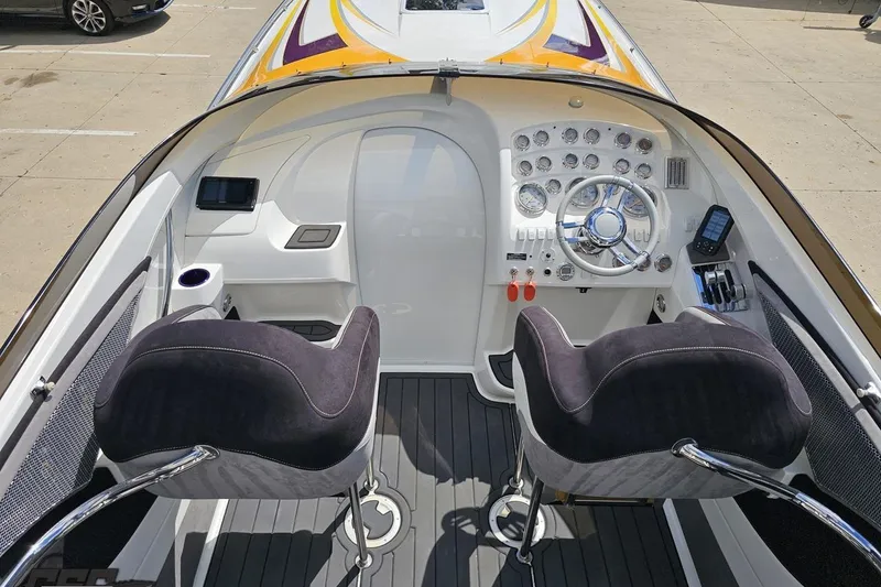 Slide: The Image of 2008 Nordic Powerboats 35 Flame MCOB cockpit with dual seats and modern dashboard controls. - 58