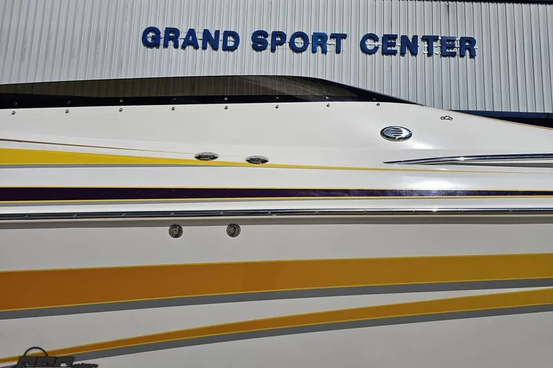 Slide: The Image of 2008 Nordic Powerboats 35 Flame MCOB at Grand Sport Center, featuring sleek yellow and purple accents. - 6
