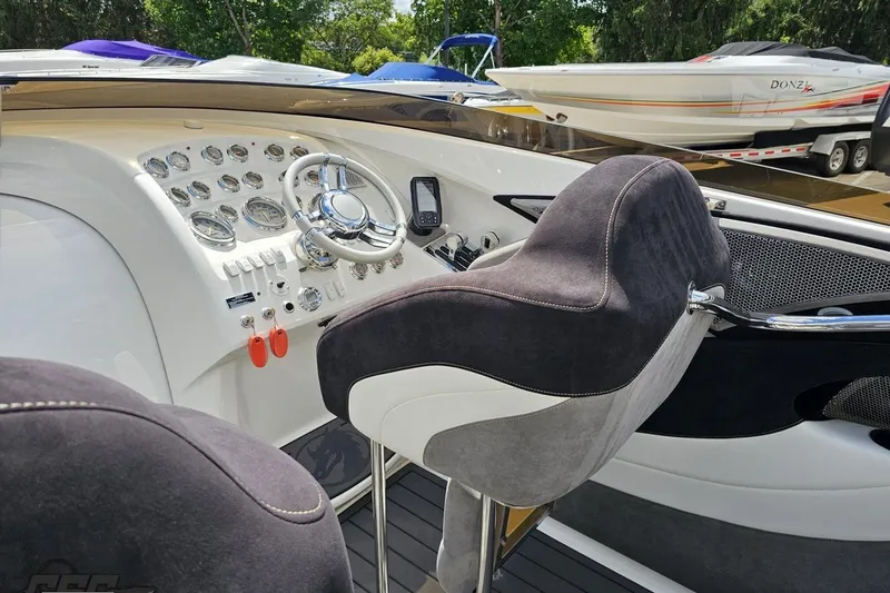 Slide: The Image of 2008 Nordic Powerboats 35 Flame MCOB cockpit with steering wheel and instrument panel. - 63