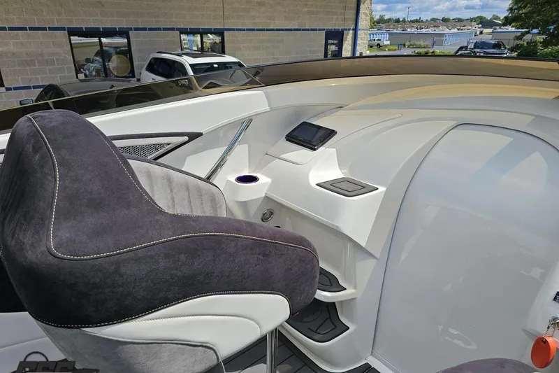Slide: The Image of 2008 Nordic Powerboats 35 Flame MCOB cockpit with modern dashboard and plush seating. - 68