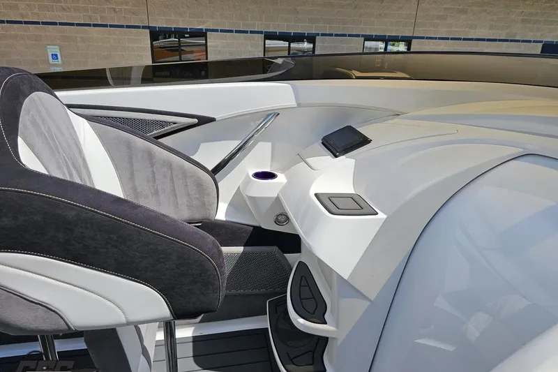 Slide: The Image of Interior of 2008 Nordic Powerboats 35 Flame MCOB, featuring sleek seating and modern dashboard. - 69
