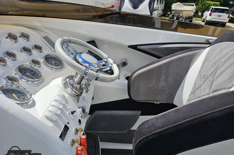 Slide: The Image of 2008 Nordic Powerboats 35 Flame MCOB cockpit with steering wheel and instrument panel. - 72