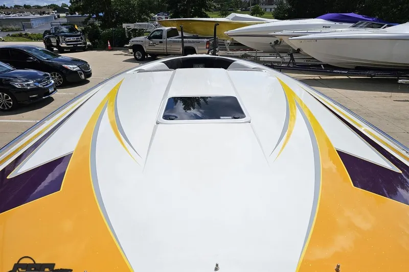 Slide: The Image of 2008 Nordic Powerboats 35 Flame MCOB with vibrant yellow and purple design on deck. - 79