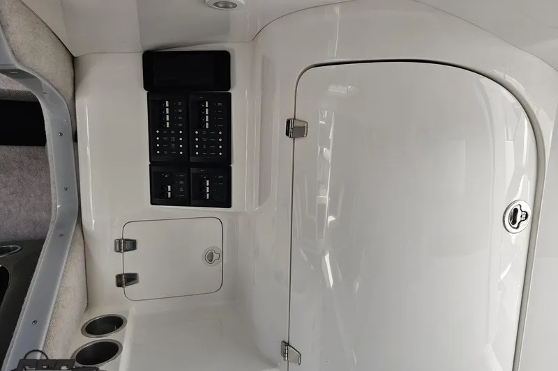 Slide: The Image of 2008 Nordic Powerboats 35 Flame MCOB interior with control panel and storage compartments. - 87