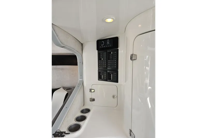 Slide: The Image of 2008 Nordic Powerboats 35 Flame MCOB interior with control panel and cup holders. - 92