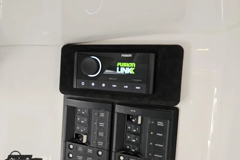 Slide: The Image of Control panel with Fusion Link audio system on 2008 Nordic Powerboats 35 Flame MCOB. - 94