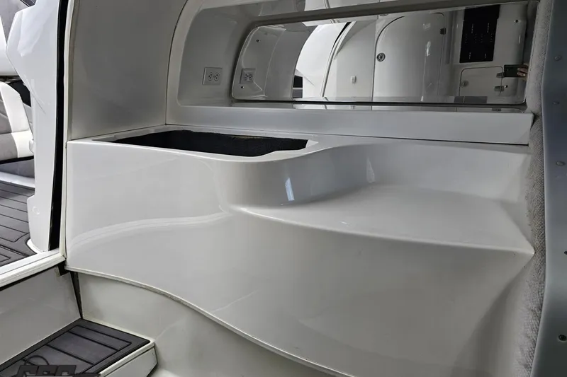 Slide: The Image of Interior view of a 2008 Nordic Powerboats 35 Flame MCOB, featuring sleek white design elements. - 96