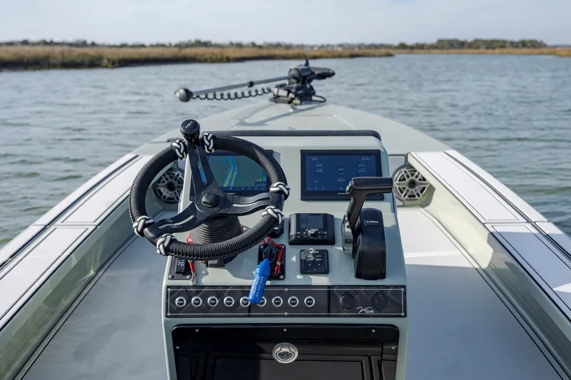 Slide: The Image of Steering console of 2025 Vtech 18 boat with advanced navigation system. - 14