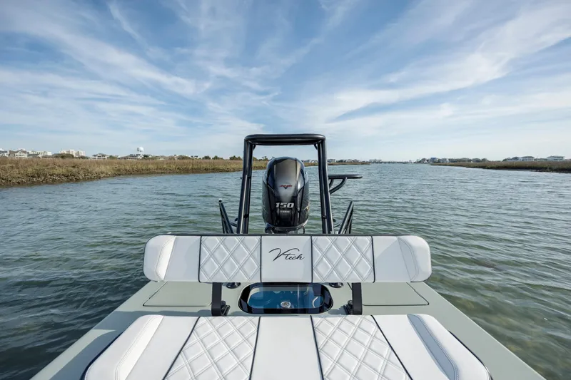 Slide: The Image of Vtech 18 boat on water, showcasing sleek design and powerful engine, 2025 model. - 17