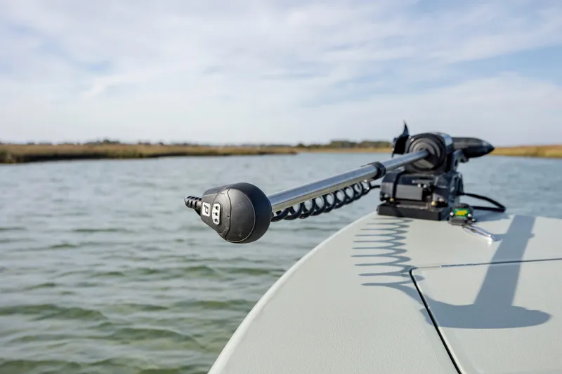 Slide: The Image of Trolling motor on a boat in calm waters, Vtech model 18, year 2025. - 22