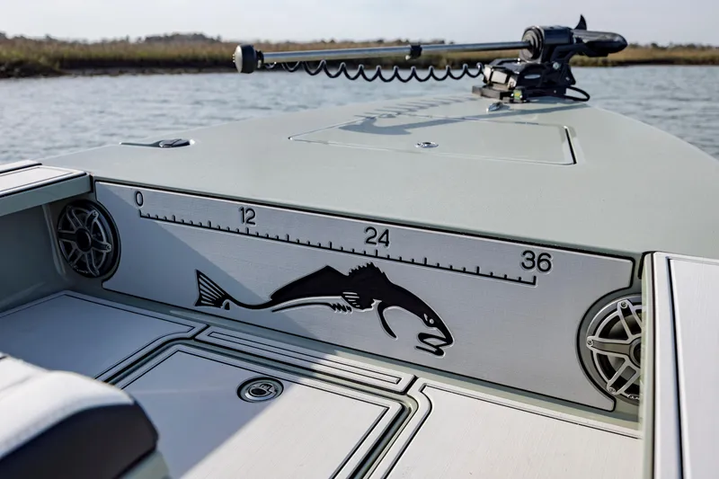 Slide: The Image of Fishing boat deck with fish ruler, Vtech 18 model, 2025, on calm water. - 23