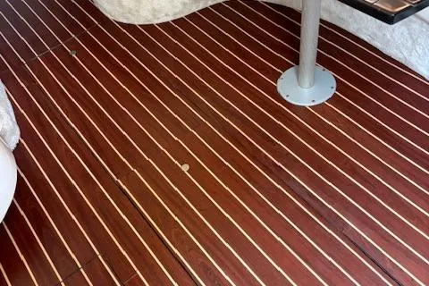 Slide: The Image of Teak deck of 1995 Sea Ray 370 Sundancer boat with metal table base. - 15