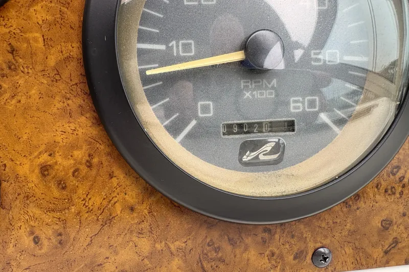 Slide: The Image of Close-up of a 1995 Sea Ray 370 Sundancer RPM gauge on a wooden dashboard. - 7