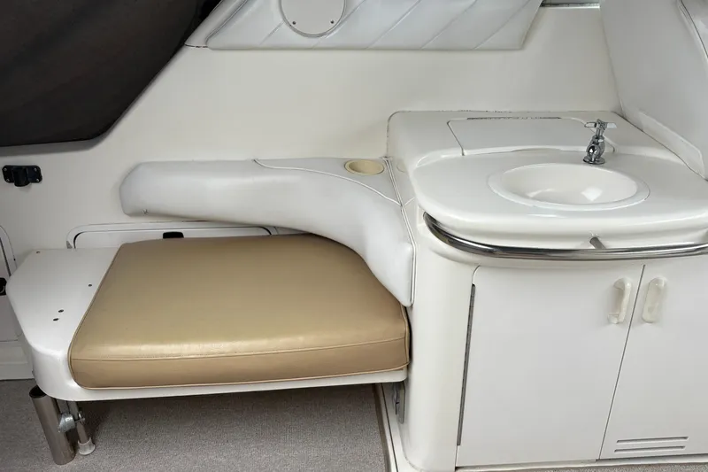 Slide: The Image of Interior of 1995 Sea Ray 370 Sundancer with seating and sink area. - 9