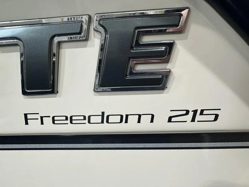 Slide: The Image of 2025 Grady-White Freedom 215 boat interior with seating and open storage compartment. - 14