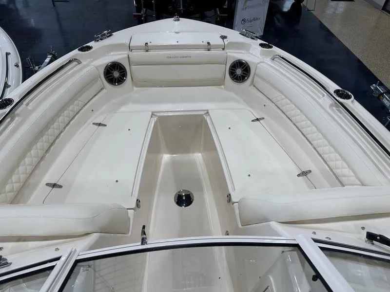 Slide: The Image of 2025 Grady-White Freedom 215 boat interior with luxurious white seating and helm. - 3