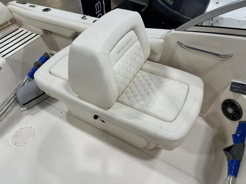 Slide: The Image of Interior of 2025 Grady-White Freedom 215 boat with modern steering and seating. - 6