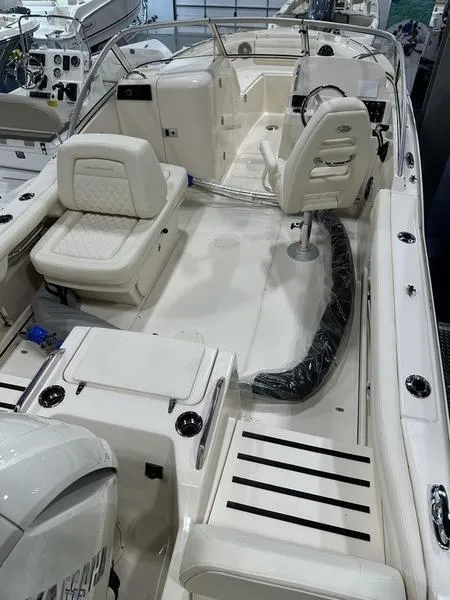 Slide: The Image of 2025 Grady-White Freedom 215 boat docked with Yamaha engine, black canopy. - 8