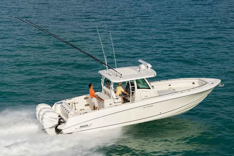 Slide: The Image of Manufacturer Provided Image: 2018 Boston Whaler 350 Outrage boat cruising on the ocean. - 0