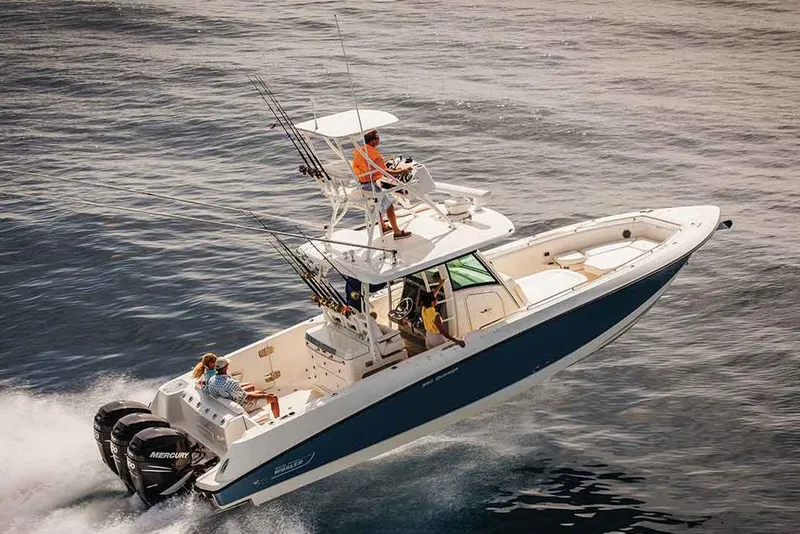 Slide: The Image of Manufacturer Provided Image: 2018 Boston Whaler 350 Outrage boat cruising on open water. - 3