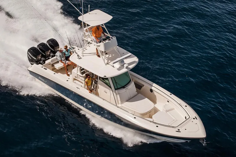 Slide: The Image of Manufacturer Provided Image: 2018 Boston Whaler 350 Outrage cruising on open water with passengers. - 4