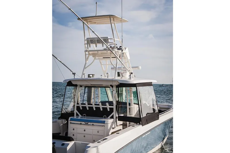 Slide: The Image of Manufacturer Provided Image: 2018 Boston Whaler 350 Outrage boat on the water with dual helm stations. - 6
