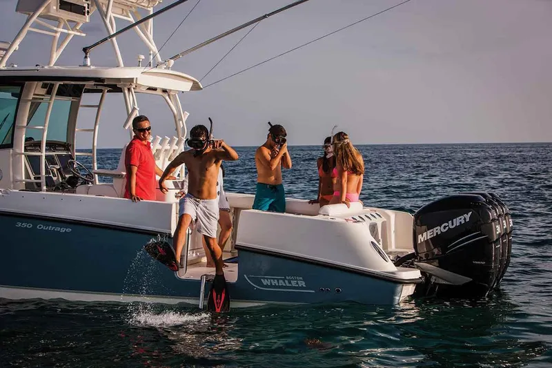Slide: The Image of Manufacturer Provided Image: People snorkeling off a 2018 Boston Whaler 350 Outrage boat in the ocean. - 7