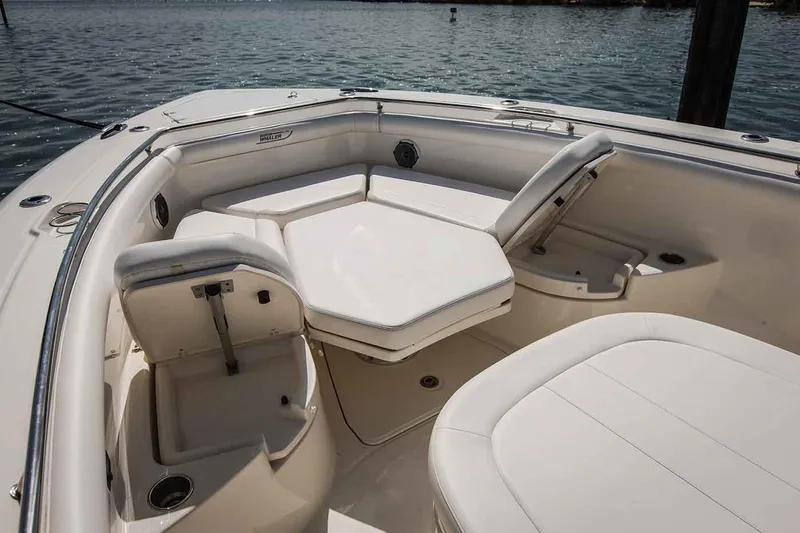 Slide: The Image of Manufacturer Provided Image: 2018 Boston Whaler 350 Outrage boat with cushioned seating area. - 8