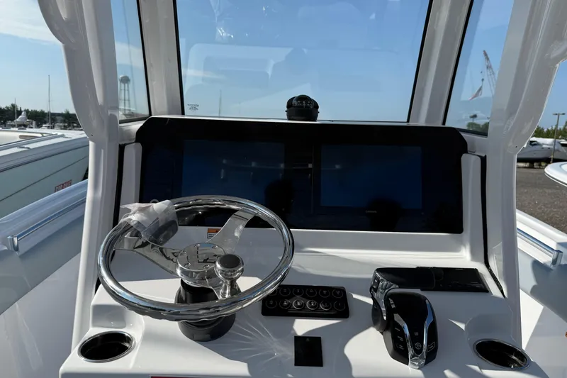 Slide: The Image of 2026 Sportsman Heritage 231 Center Console dashboard with steering wheel and navigation screens. - 3