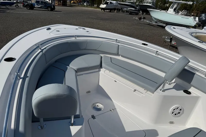 Slide: The Image of 2026 Sportsman Heritage 231 Center Console boat interior with cushioned seating. - 9