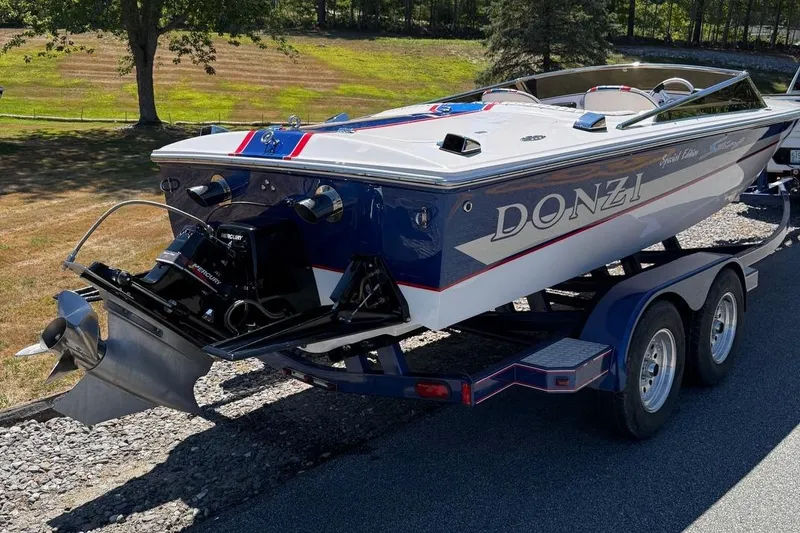 Slide: The Image of 2002 Donzi 22 Classic boat on trailer, featuring sleek design and vibrant colors. - 8