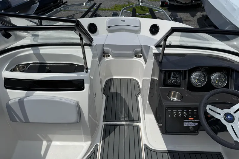 Slide: The Image of 2025 Bayliner VR5 Bowrider I/O interior with sleek dashboard and modern controls. - 10
