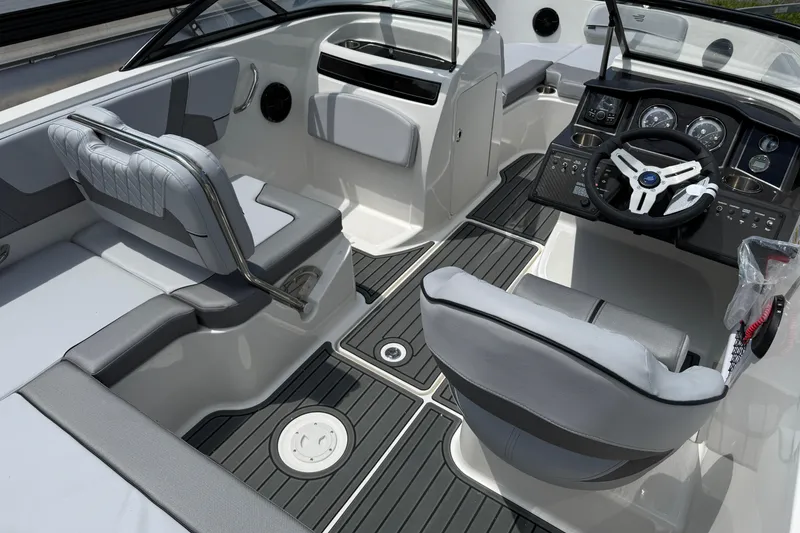 Slide: The Image of 2025 Bayliner VR5 Bowrider I/O interior with modern dashboard and seating. - 6