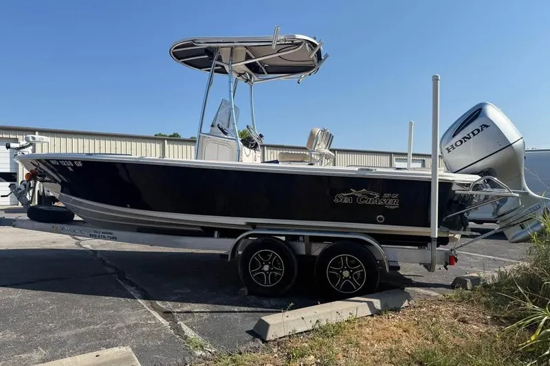 Slide: The Image of 2018 Carolina Skiff 23LX boat on trailer with Honda outboard motor. - 5