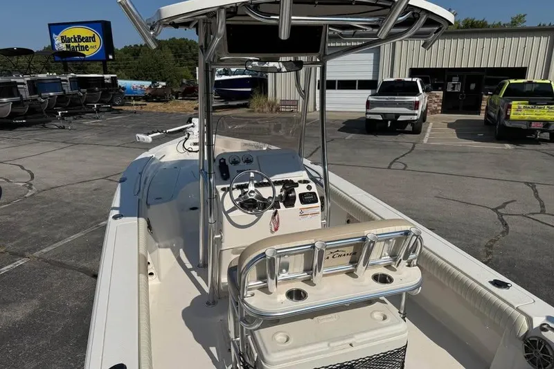 Slide: The Image of 2018 Carolina Skiff 23LX boat at BlackBeard Marine dealership, featuring center console and seating. - 9