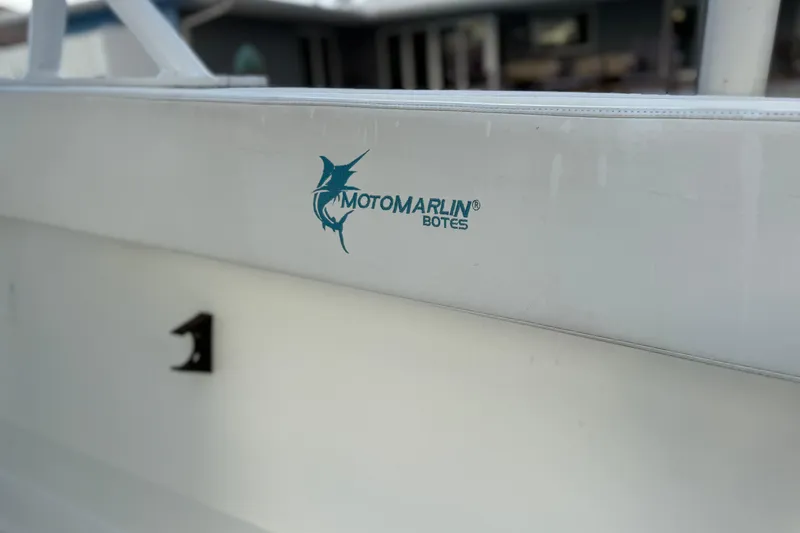 Slide: The Image of 2021 Marlin 39 CC boat with "Motomarlin Botes" logo on the side. - 11