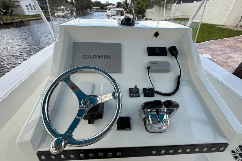 Slide: The Image of 2021 Marlin 39 CC boat dashboard with Garmin navigation and control systems. - 22