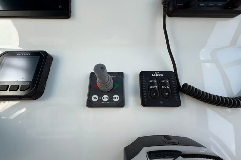 Slide: The Image of Control panel of a 2021 Marlin 39 CC boat with Suzuki and Lenco systems. - 26
