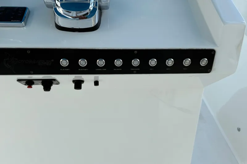 Slide: The Image of Control panel of 2021 Marlin 39 CC boat with labeled switches and controls. - 33