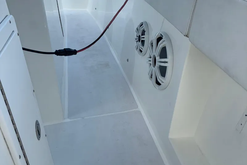 Slide: The Image of 2021 Marlin 39 CC boat interior with speakers and wiring. - 38