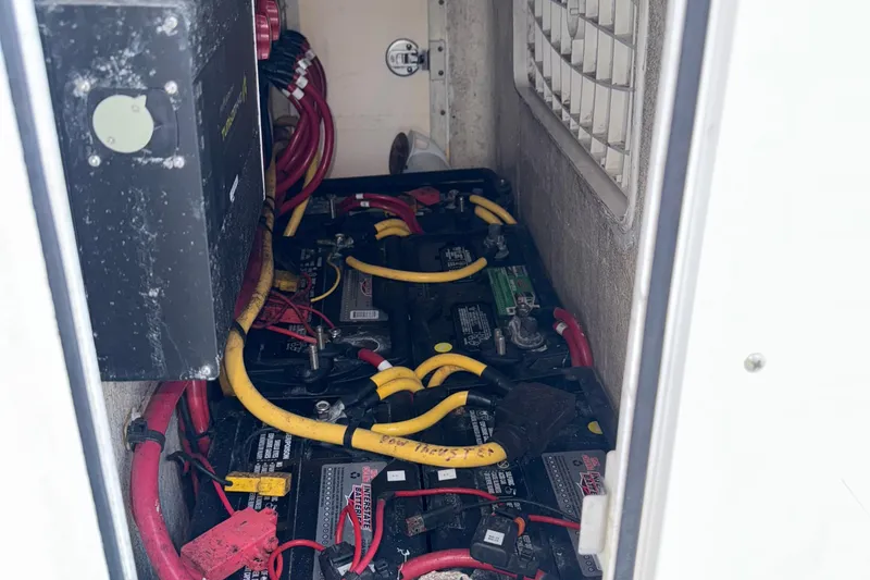 Slide: The Image of Battery compartment of 2021 Marlin 39 CC boat with cables and connections. - 39