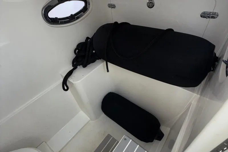 Slide: The Image of 2021 Marlin 39 CC boat interior with black fenders and ropes. - 45