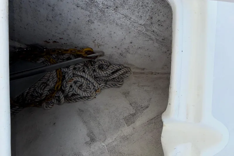 Slide: The Image of Anchor and rope storage in 2021 Marlin 39 CC boat compartment. - 57
