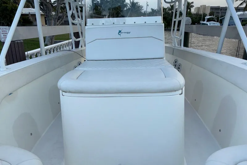 Slide: The Image of 2021 Marlin 39 CC boat interior with white seating and console. - 58