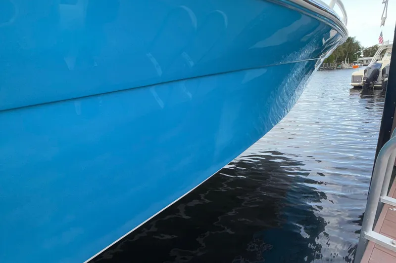 Slide: The Image of Blue 2021 Marlin 39 CC boat docked on calm water. - 70