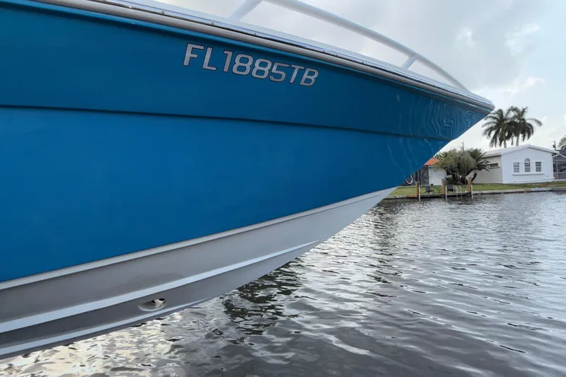 Slide: The Image of 2021 Marlin 39 CC boat on water, blue hull, registration FL1885TB. - 73
