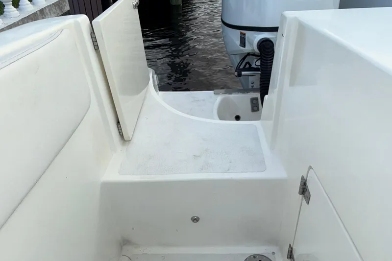 Slide: The Image of 2021 Marlin 39 CC boat deck with open hatch and visible engine. - 76